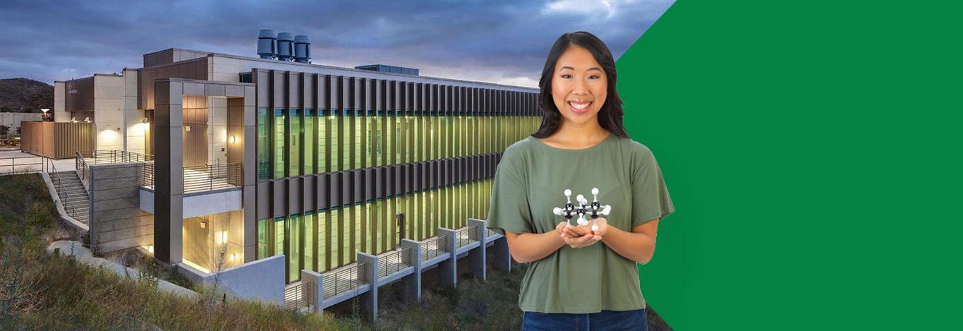 Woman holding molecular model